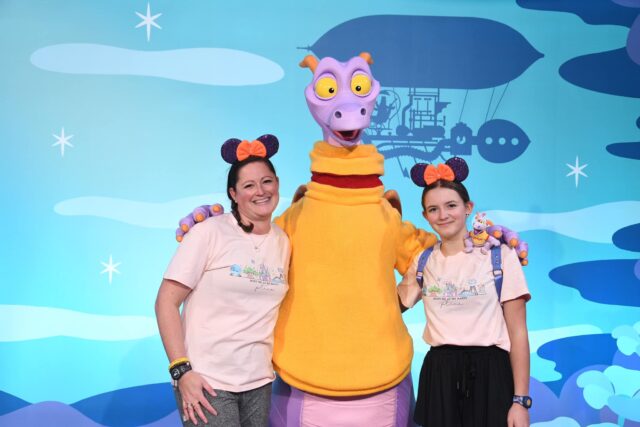 Travel advisor Lauren Strob posing with her daughter Bella and Figment at EPCOT.