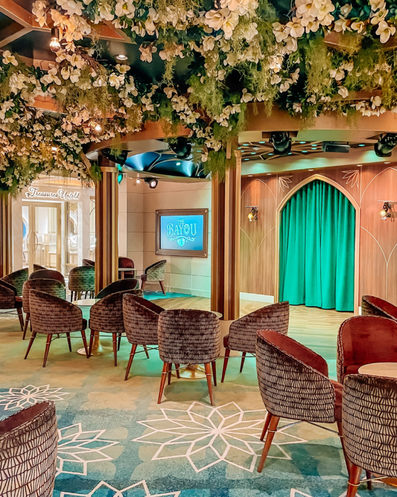 Open seating area at The Bayou lounge aboard the Disney Wish